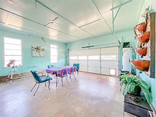 a view of a room with furniture and a potted plant