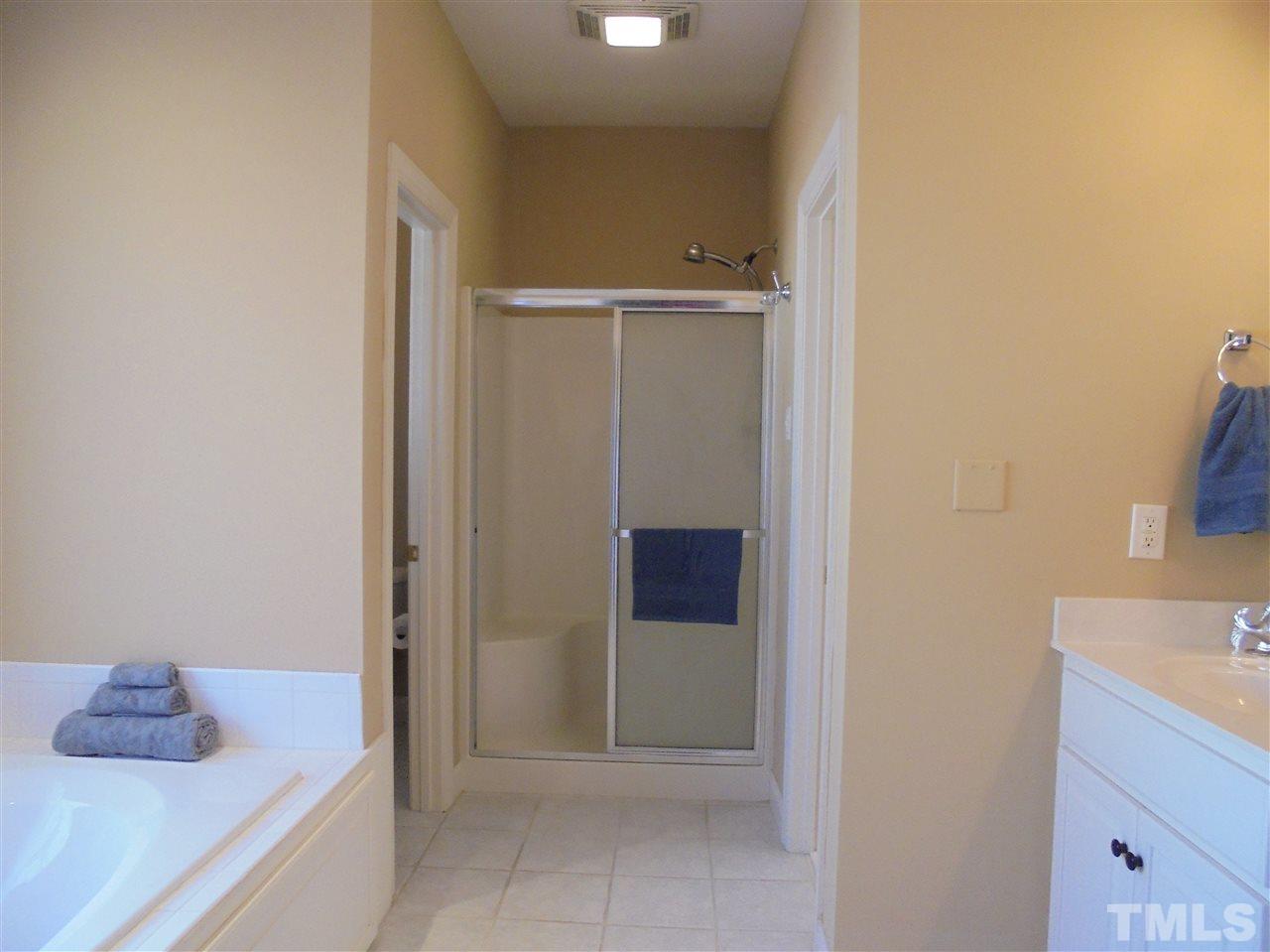 5763 Roseheath Road Bailey, NC 27807 - Photo 14 of 25 a bathroom with a tub shower and sink