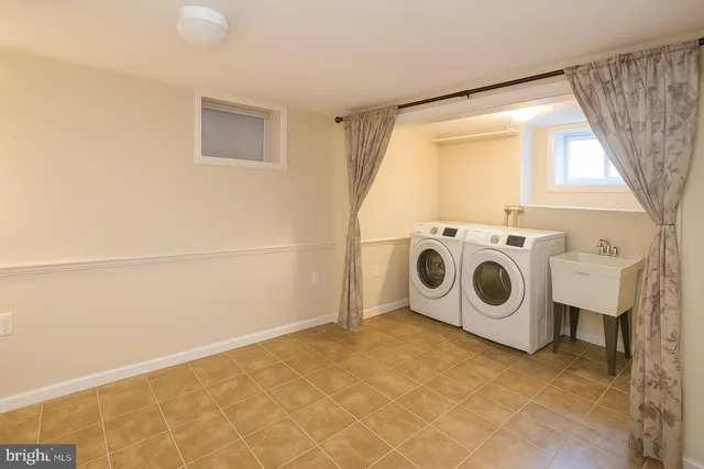 a utility room with dryer and washer