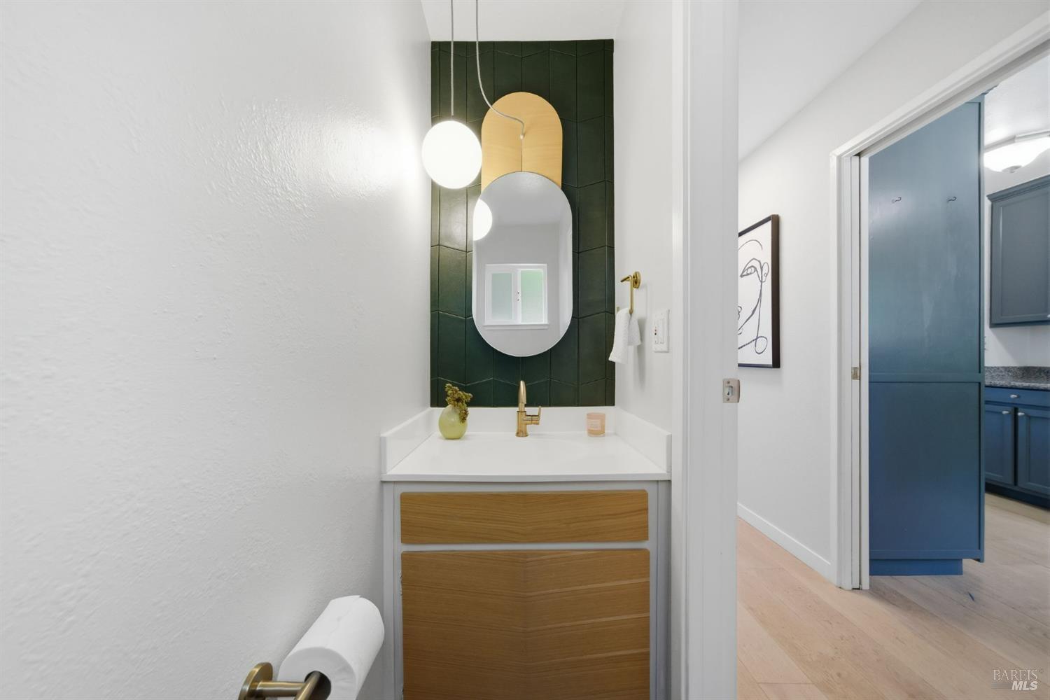 10 Professional Center Parkway, Unit 1 San Rafael, CA 94903 - Photo 14 of 35 a bathroom with a sink mirror and vanity