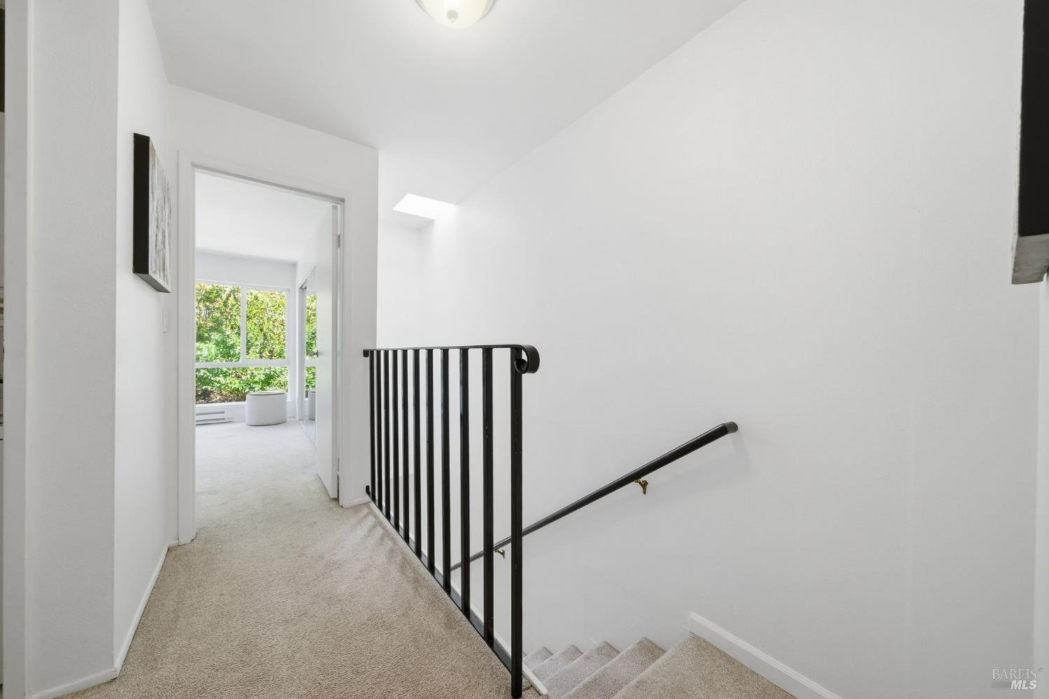 10 Professional Center Parkway, Unit 1 San Rafael, CA 94903 - Photo 16 of 35 a view of a hallway with wooden floor and stairs