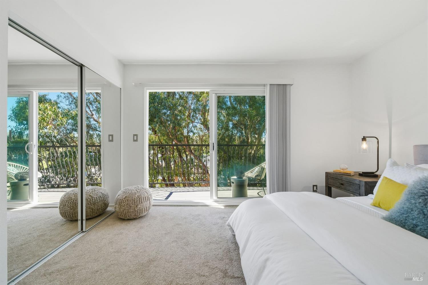 10 Professional Center Parkway, Unit 1 San Rafael, CA 94903 - Photo 18 of 35 a bedroom with a bed and glass door