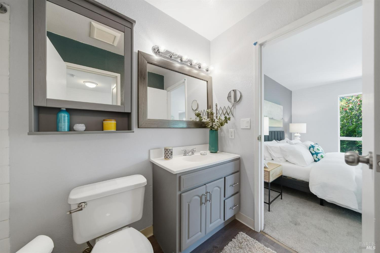 10 Professional Center Parkway, Unit 1 San Rafael, CA 94903 - Photo 26 of 35 a bathroom with a toilet sink and mirror