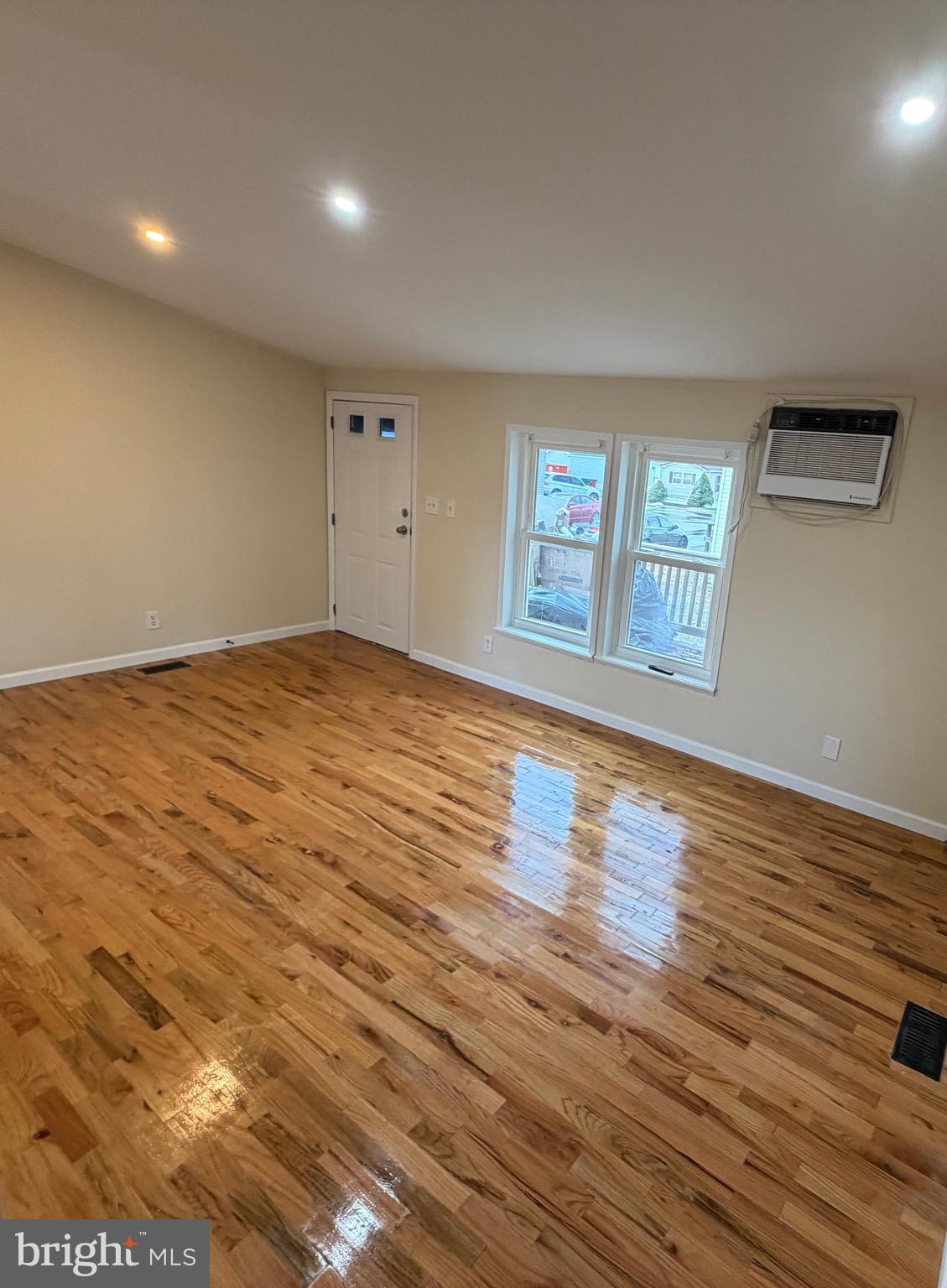 887 Aspen Avenue Spring City, PA 19475 - Photo 18 of 21 an empty room with wooden floor and windows