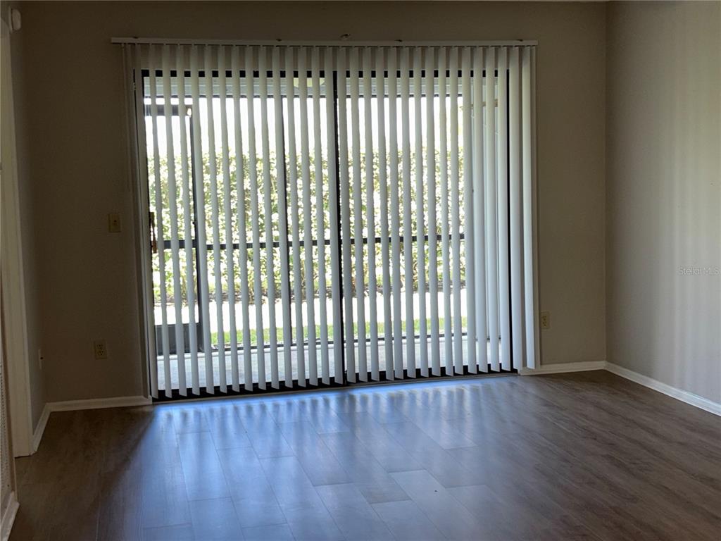 26485 Rampart Boulevard, Unit D1 Punta Gorda, FL 33983 - Photo 24 of 29 a view of wooden floor and a window