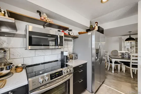 a kitchen with a stove and a microwave