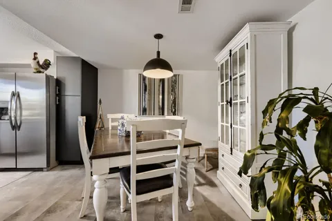 a view of a livingroom with furniture and staircase