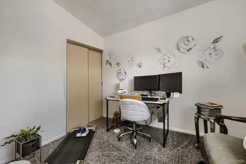 a view of a workspace with furniture