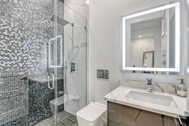 a view of staircase with wooden floor and white walls