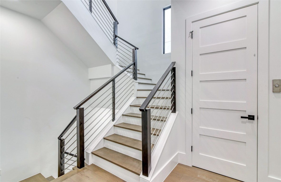 1406 Fairview Street Houston, TX 77006 - Photo 20 of 34 a view of staircase with wooden floor and white walls