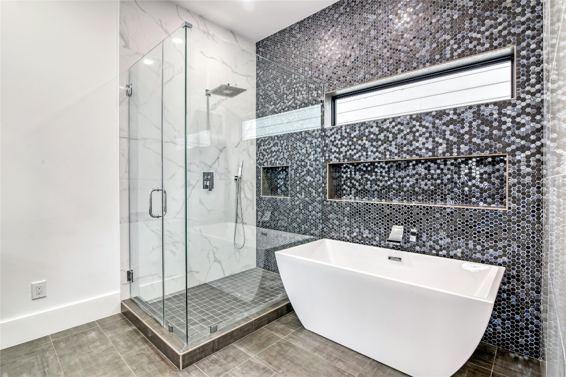 1406 Fairview Street Houston, TX 77006 - Photo 24 of 34 a bathroom with a bathtub and shower