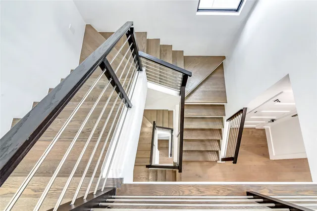 a living room with kitchen island furniture and a floor to ceiling window
