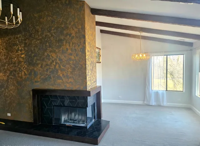 a view of a livingroom with furniture and windows