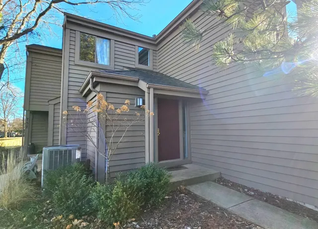 a front view of a house with stairs