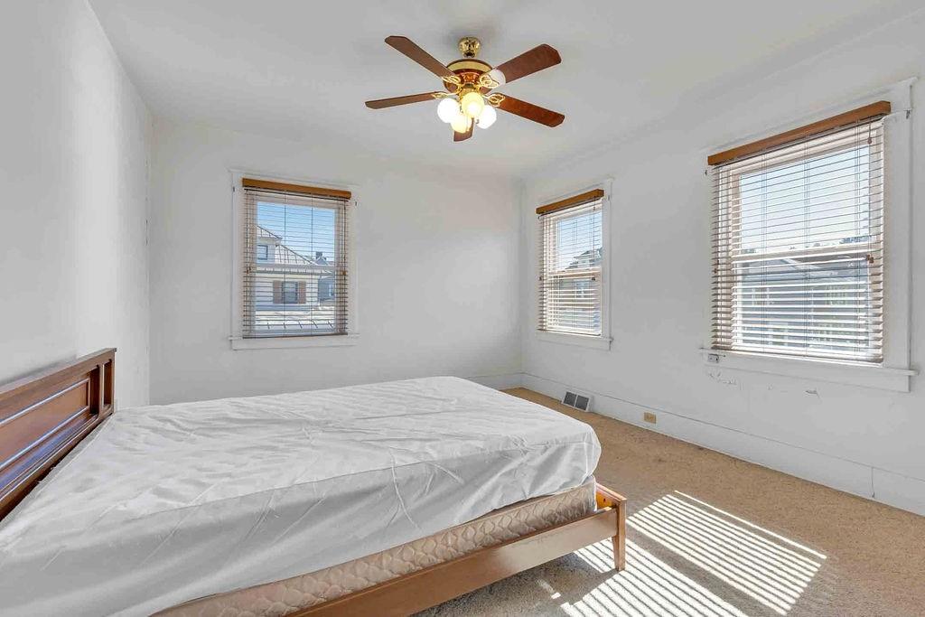 938 Atlantic Avenue Monaca, PA 15061 - Photo 15 of 24 a bedroom with a bed and a window