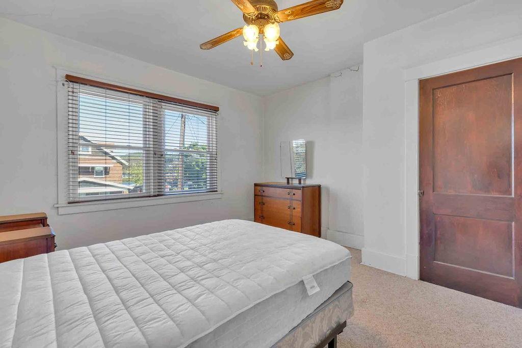 938 Atlantic Avenue Monaca, PA 15061 - Photo 17 of 24 a bedroom with a bed and a window