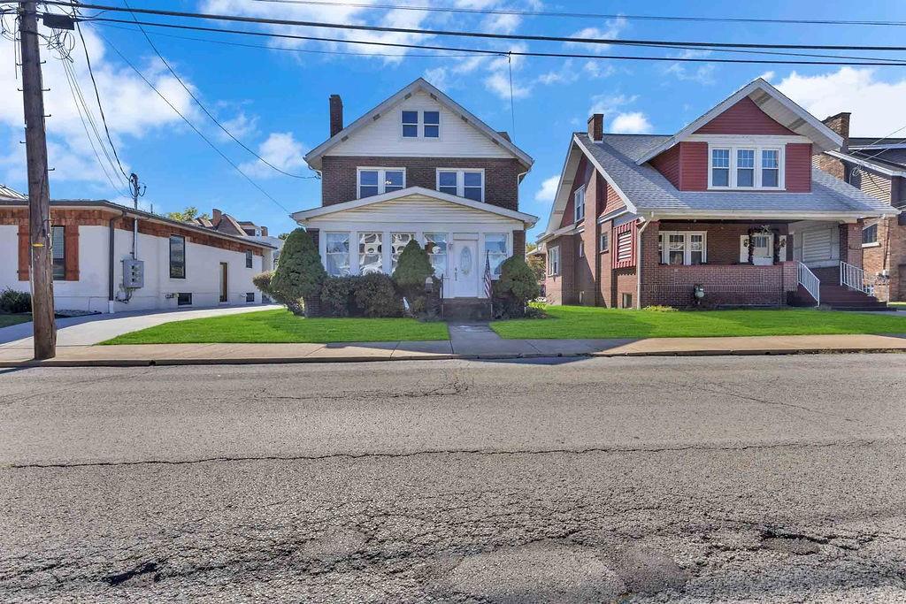 938 Atlantic Avenue Monaca, PA 15061 - Photo 24 of 24 a front view of a house with a yard and garage