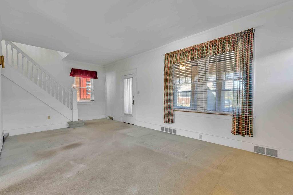 938 Atlantic Avenue Monaca, PA 15061 - Photo 5 of 24 a view of an empty room with a window