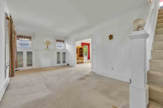 a view of a livingroom with furniture and window