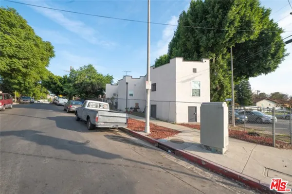 a row of street with parked cars