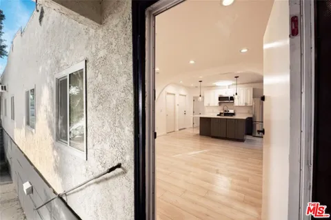 a view of a living room with a large window