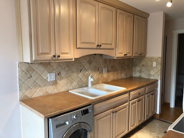 725 West Huntington Commons Road, Unit 401 Mount Prospect, IL 60056 - Photo 3 of 13 a utility room with dryer and washer