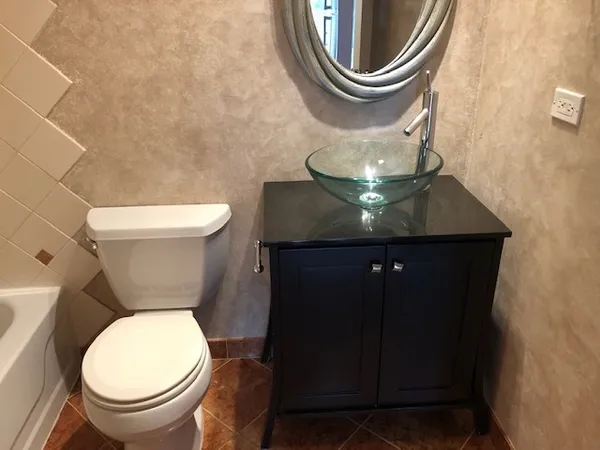 a bathroom with a toilet and a sink
