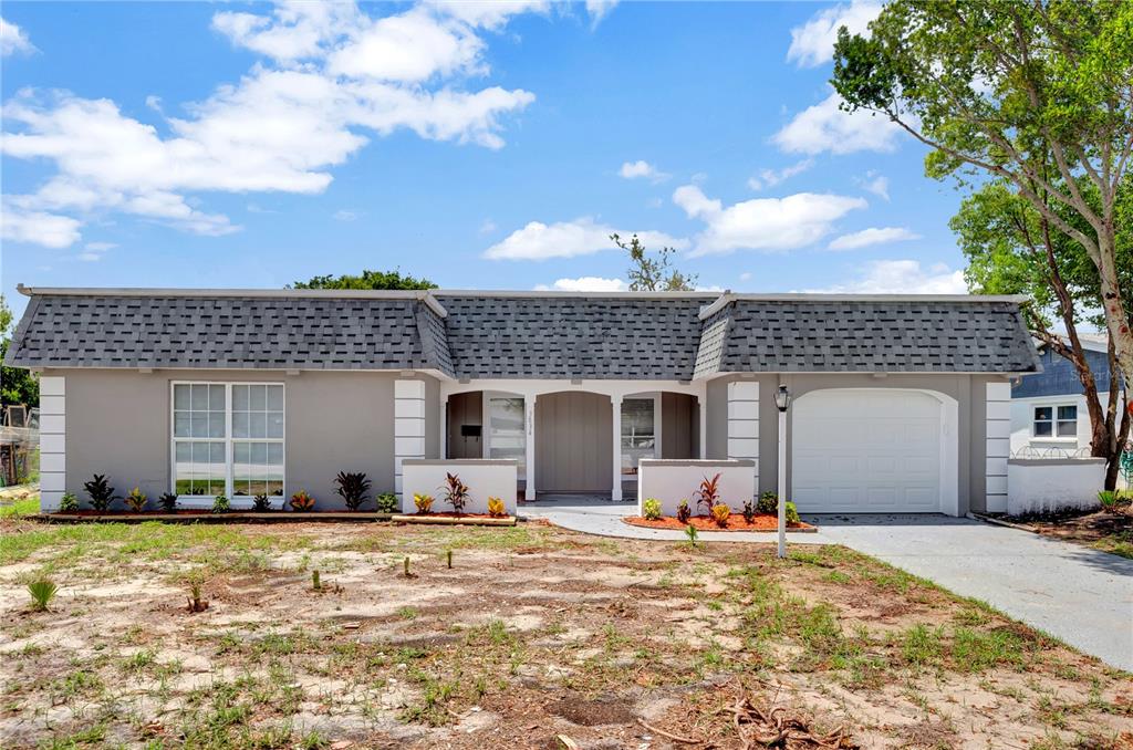 3834 Grayton Drive New Port Richey, FL 34652 - Photo 1 of 1 a view of a house with backyard