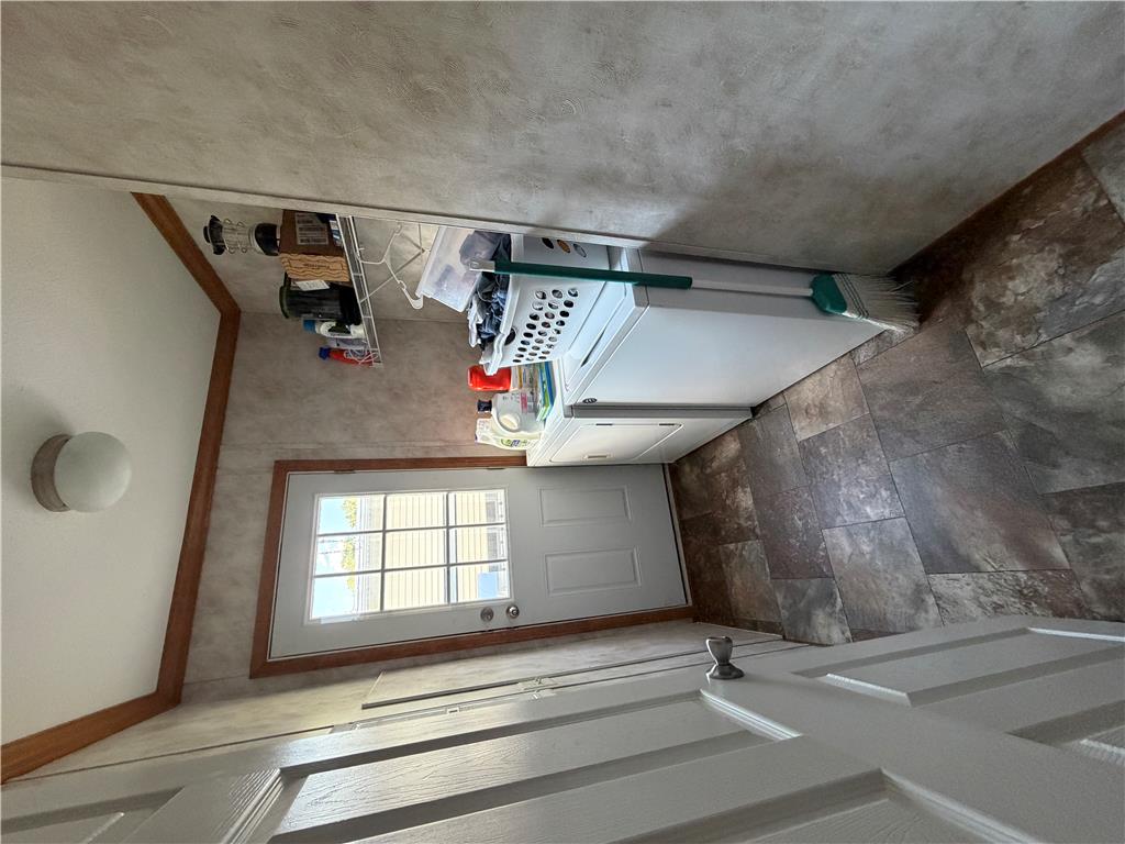 12 Springridge Road Bath, PA 18014 - Photo 56 of 61 Functional laundry space with easy outdoor access and durable tile flooring.