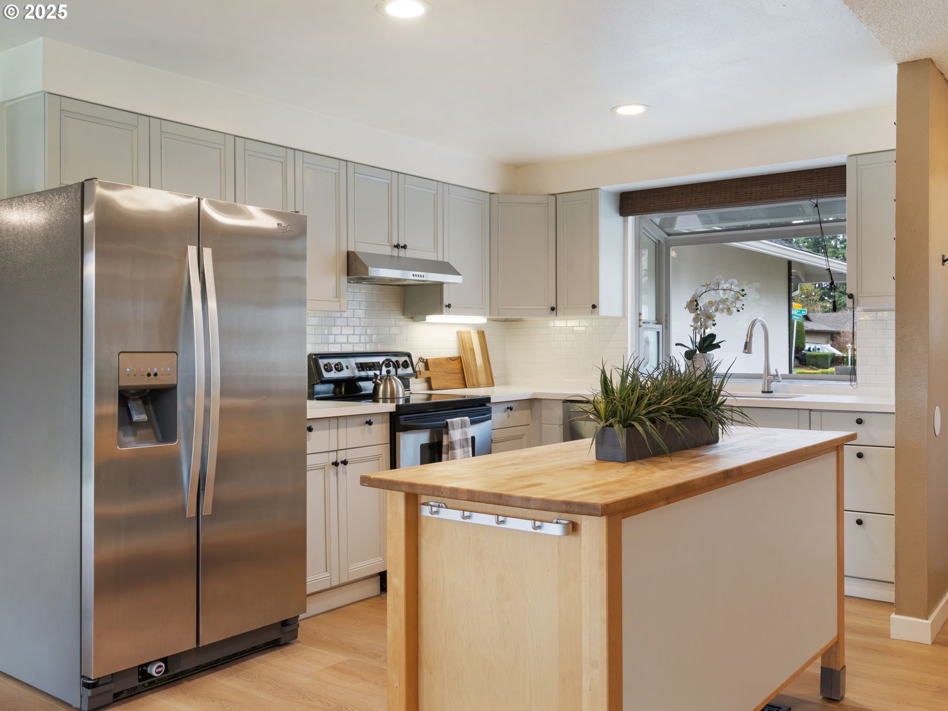 824 Southeast 207th Avenue Gresham, OR 97030 - Photo 15 of 47 a kitchen with stainless steel appliances a refrigerator sink and stove