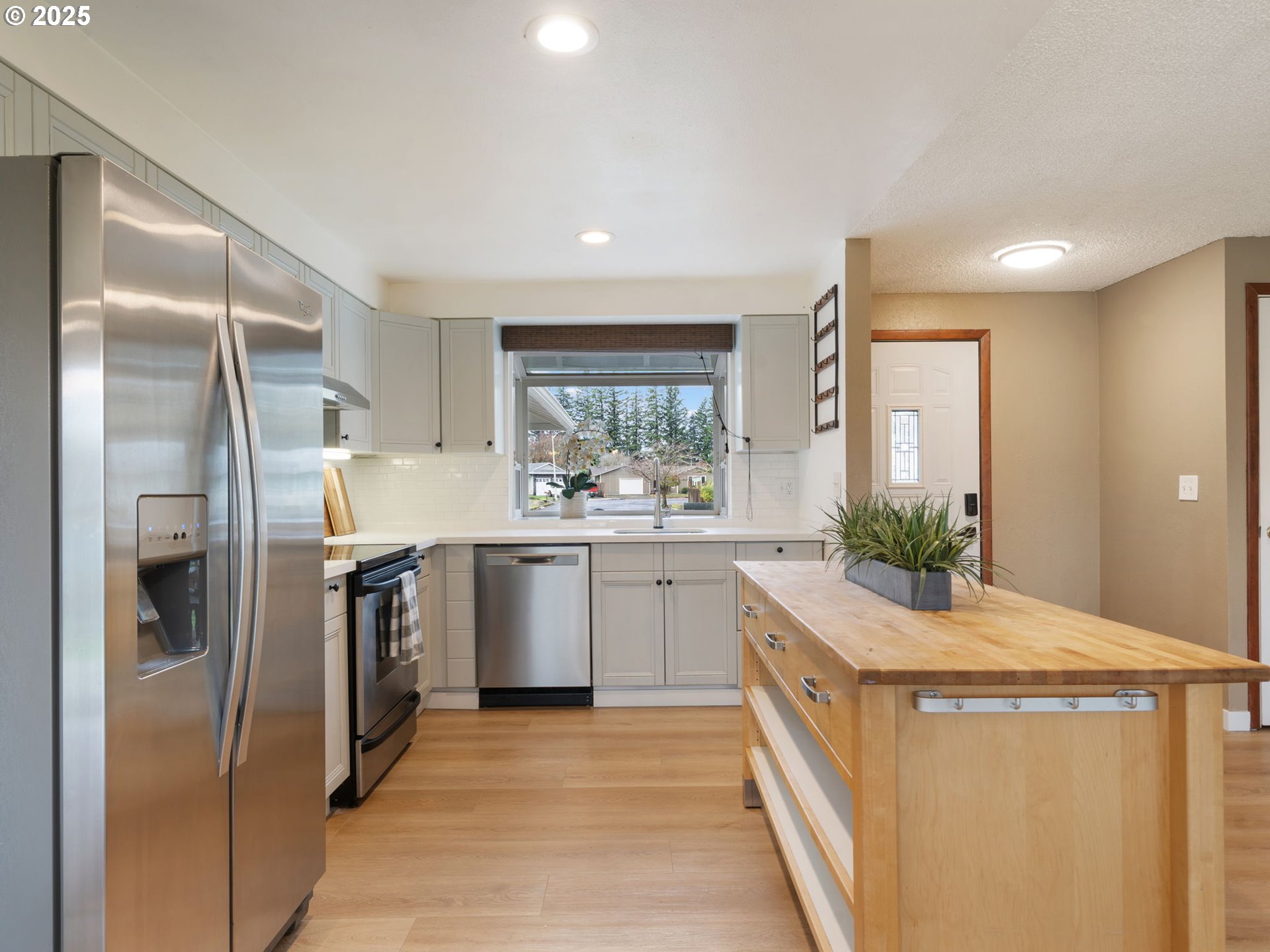 824 Southeast 207th Avenue Gresham, OR 97030 - Photo 16 of 47 a kitchen with a refrigerator sink and stove