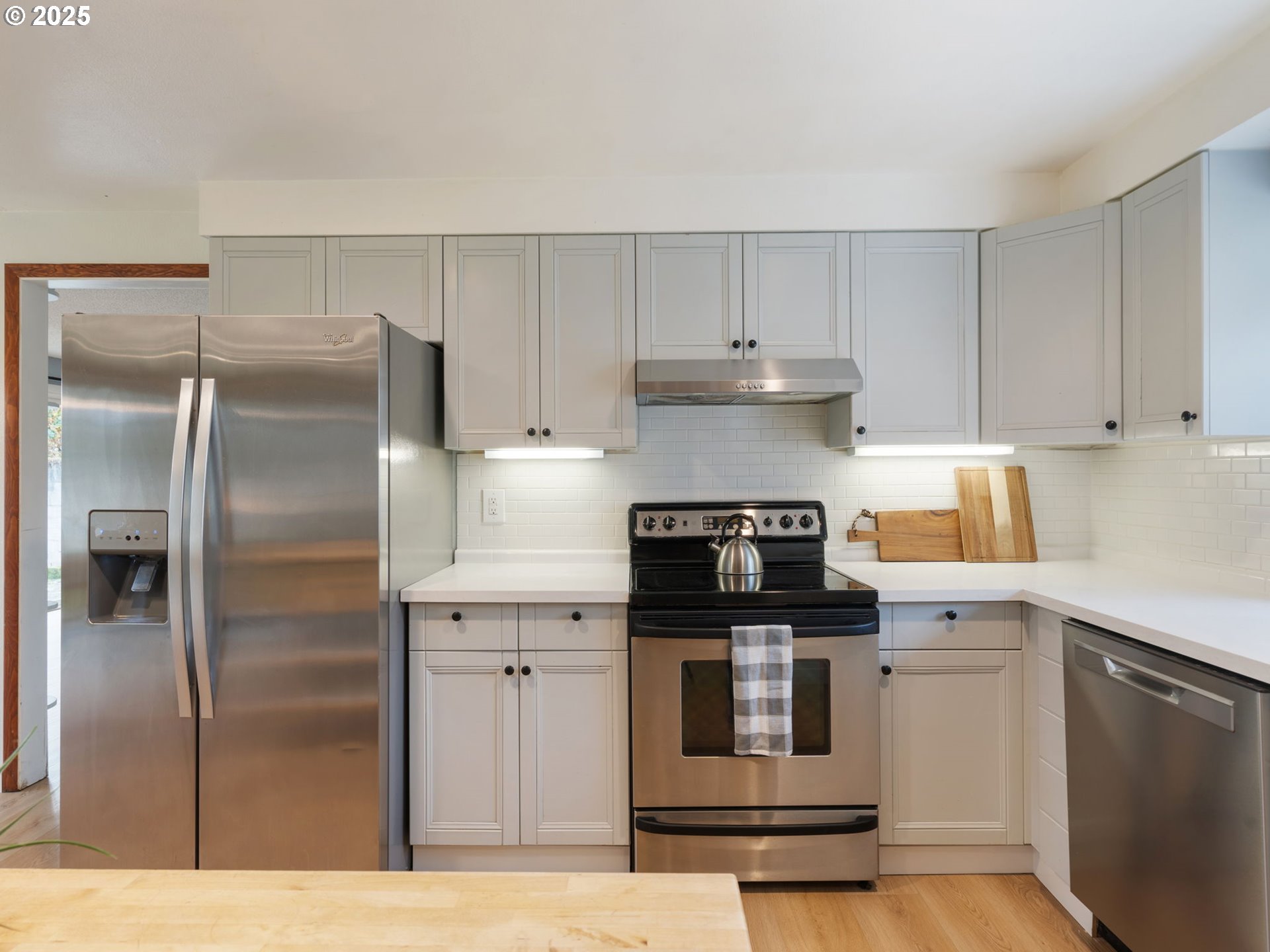824 Southeast 207th Avenue Gresham, OR 97030 - Photo 17 of 47 a kitchen with a refrigerator and a stove top oven