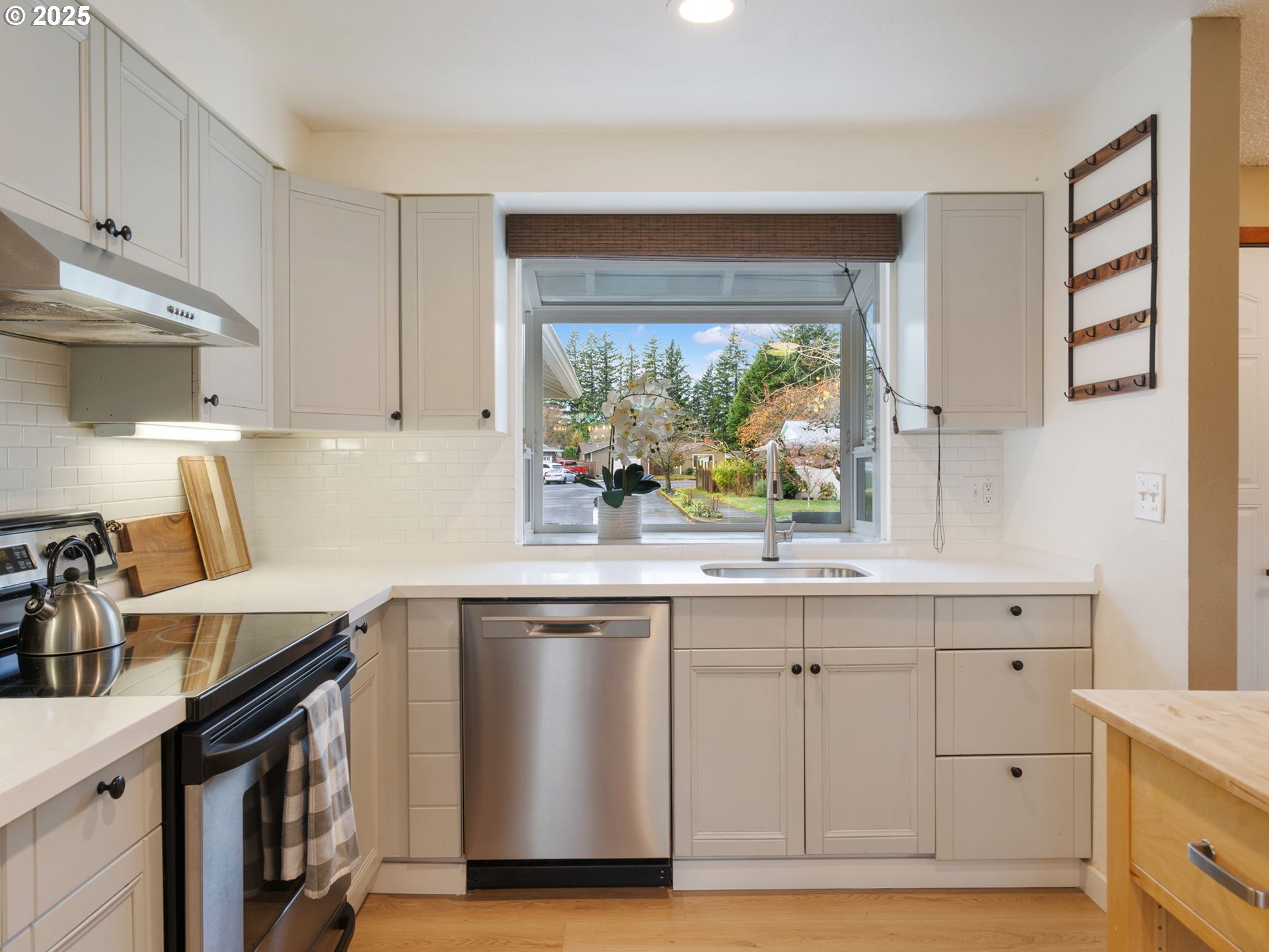 824 Southeast 207th Avenue Gresham, OR 97030 - Photo 18 of 47 a kitchen with a sink and cabinets