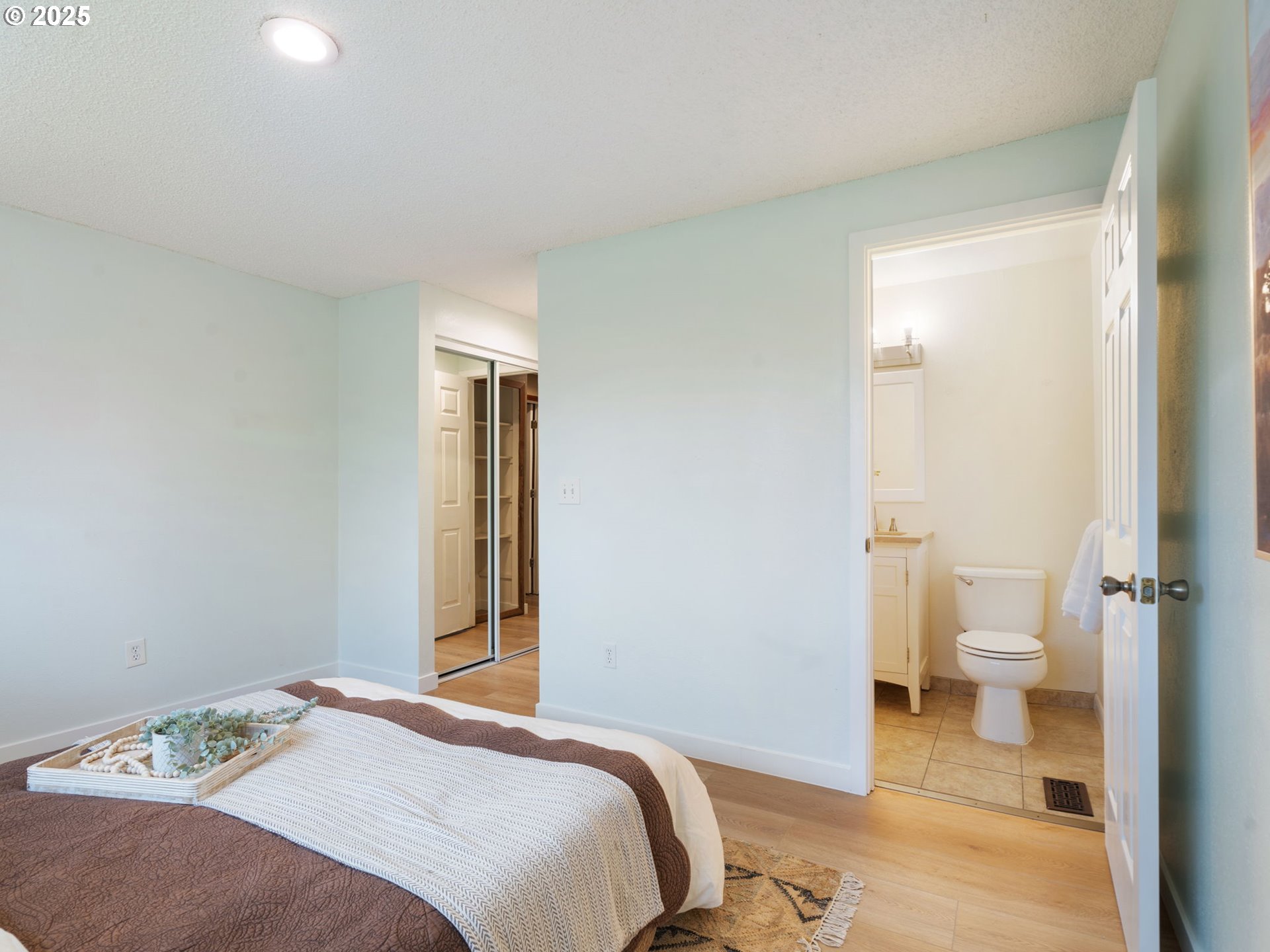 824 Southeast 207th Avenue Gresham, OR 97030 - Photo 27 of 47 a bedroom with a bed and a view of bathroom