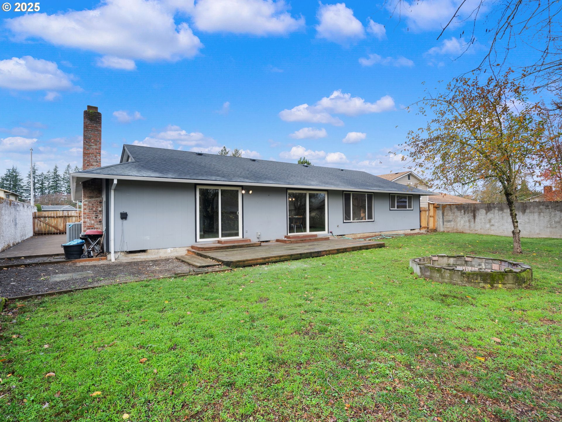 824 Southeast 207th Avenue Gresham, OR 97030 - Photo 46 of 47 a front view of a house with a garden and yard