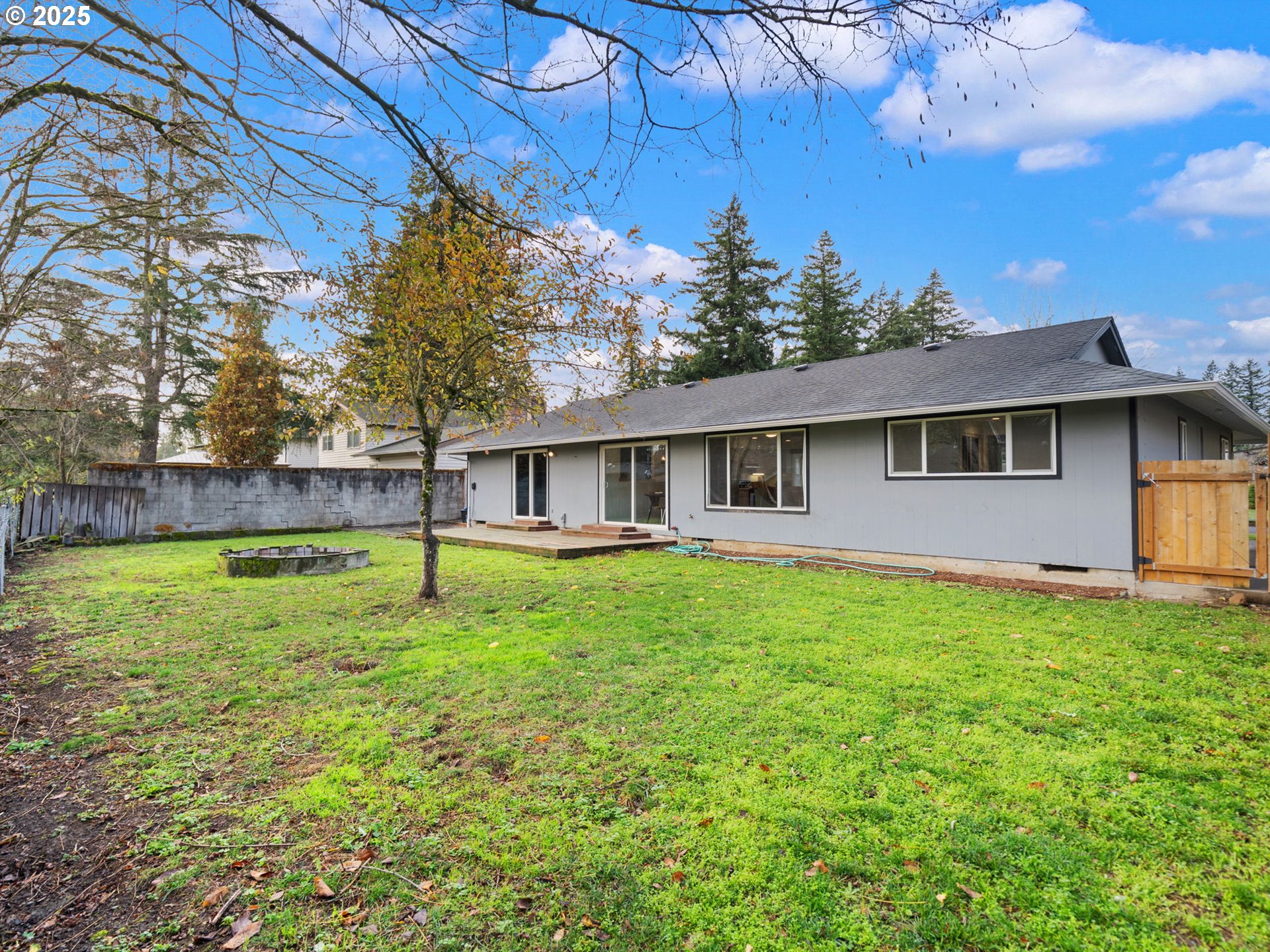 824 Southeast 207th Avenue Gresham, OR 97030 - Photo 47 of 47 a view of a house with a backyard and a tree