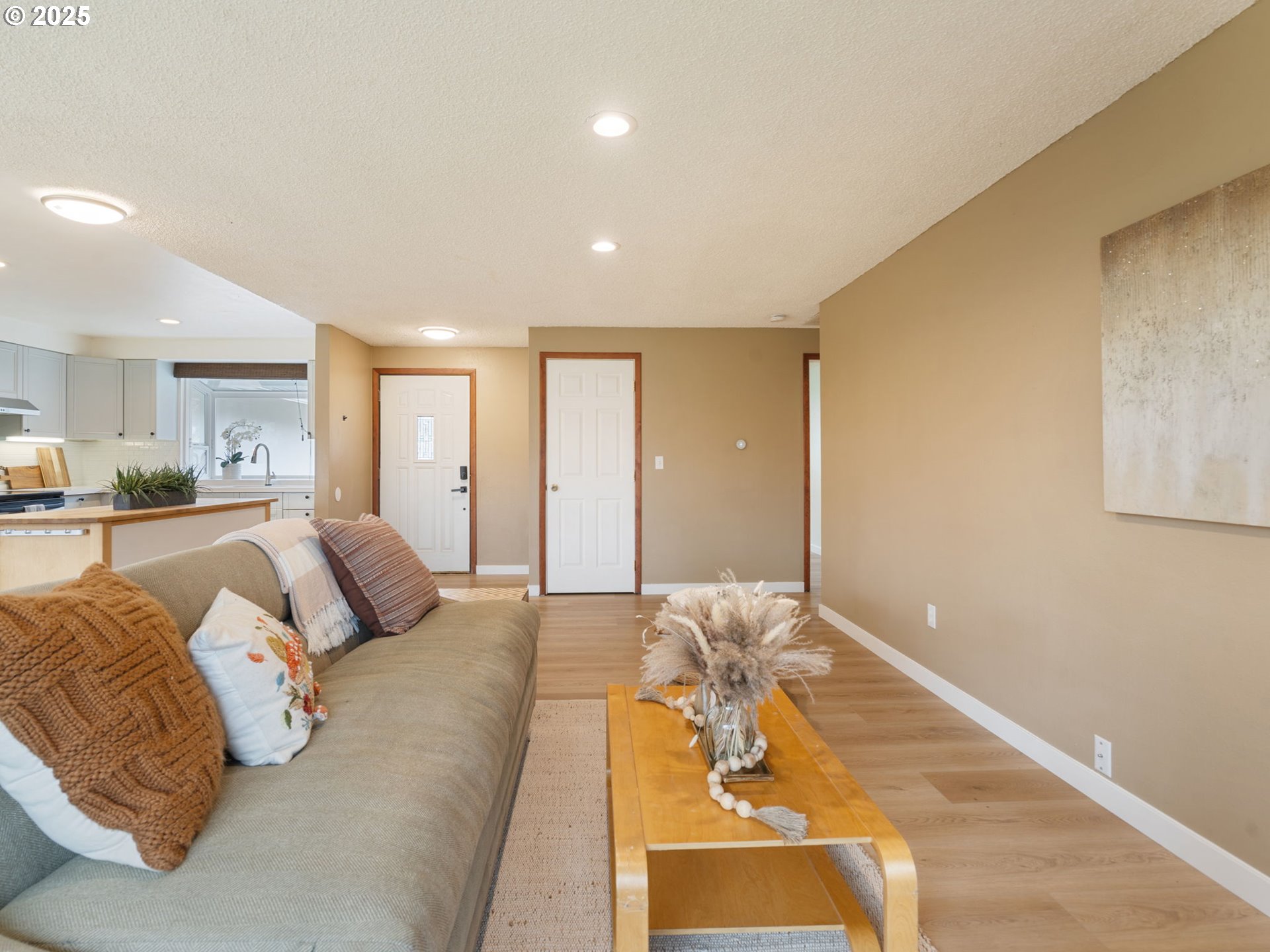 824 Southeast 207th Avenue Gresham, OR 97030 - Photo 8 of 47 a spacious bedroom with a large bed and a couch
