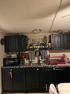 7359 Lewis Ford Road Gladys, VA 24554 - Photo 13 of 24 a kitchen with a sink and cabinets