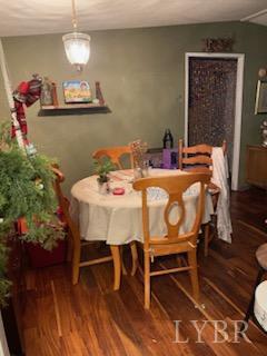 7359 Lewis Ford Road Gladys, VA 24554 - Photo 14 of 24 a view of a dining room with furniture and wooden floor