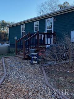 7359 Lewis Ford Road Gladys, VA 24554 - Photo 20 of 24 a view of a house with wooden deck front of house