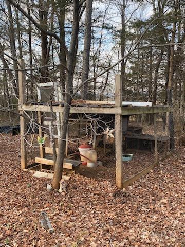 7359 Lewis Ford Road Gladys, VA 24554 - Photo 5 of 24 a view of a wooden chairs and a table in the back