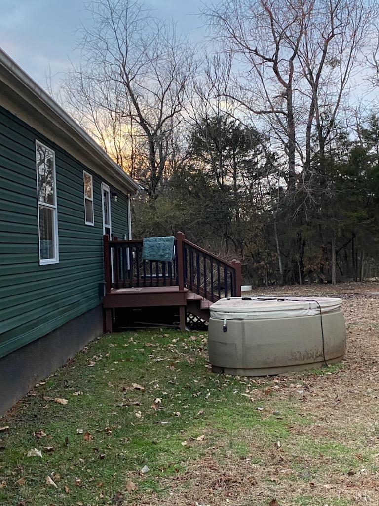 7359 Lewis Ford Road Gladys, VA 24554 - Photo 7 of 24 a view of a chair and tables in the backyard