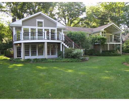 Undisclosed Address Darien, CT 06820 - Photo 2 of 3 a front view of a house with a yard