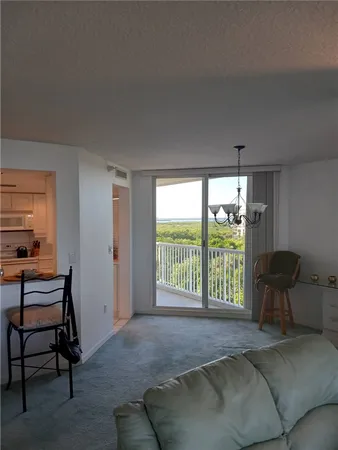 a bedroom with a bed and a chair