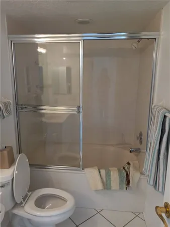 a bathroom with a shower and a toilet