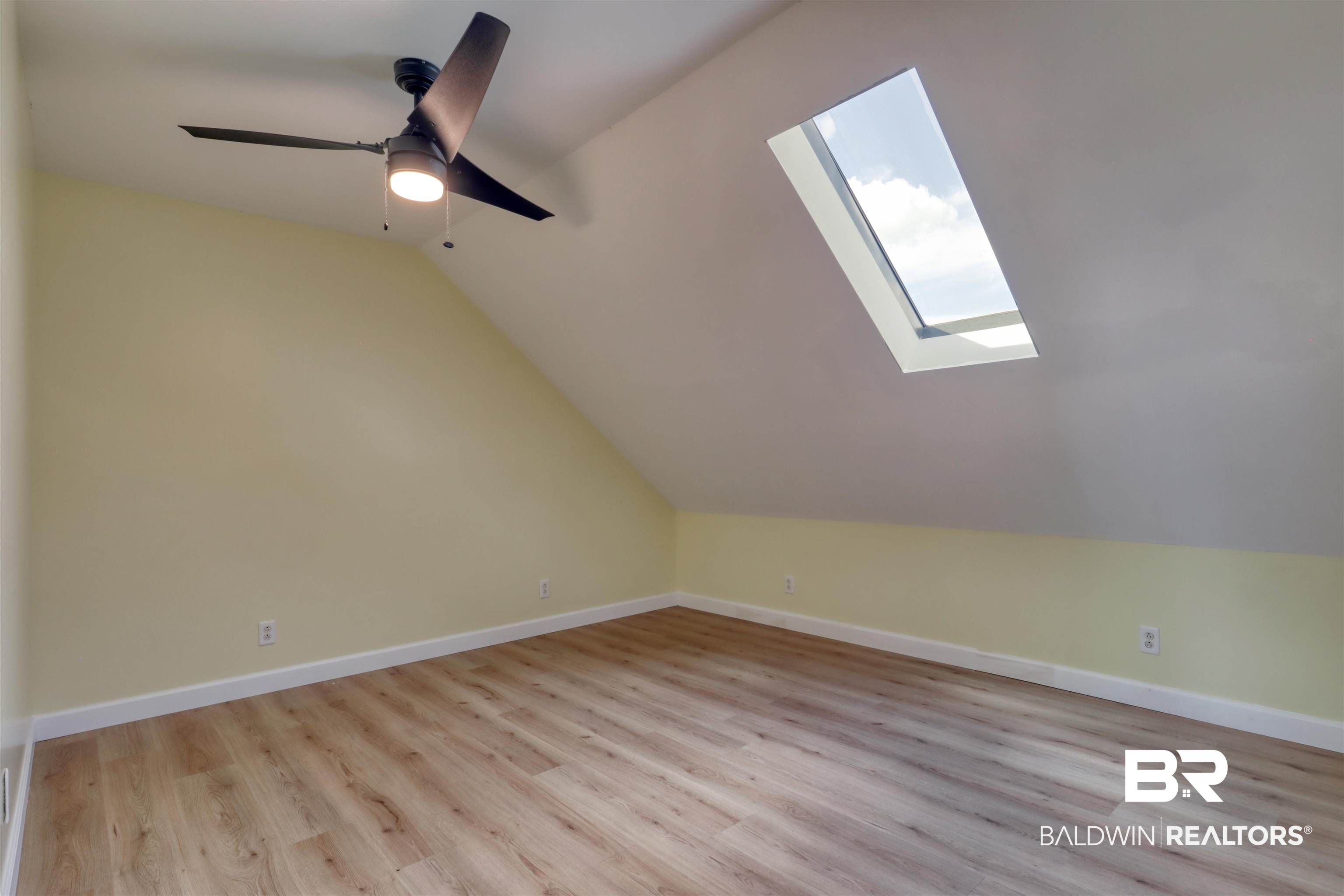 28461 Gardner Road Elberta, AL 36530 - Photo 21 of 46 Bonus room featuring a skylight, lofted ceiling, light wood-type flooring, and ceiling fan