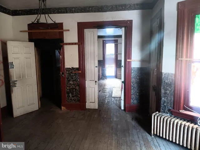 a view of livingroom with hardwood floor and hallway