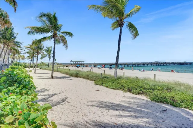 a view of a street with a yard