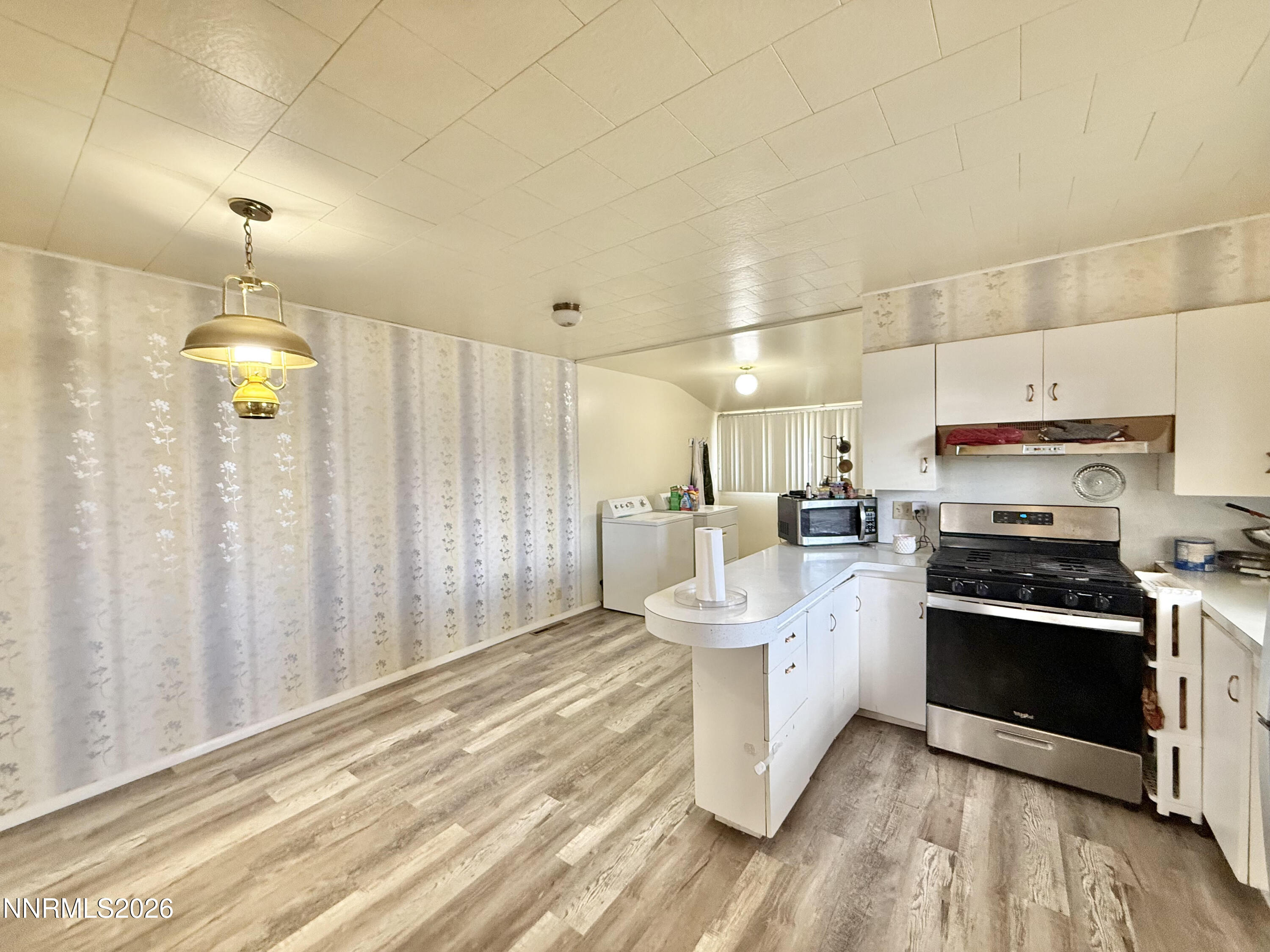 68 West 5th Street Battle Mountain, NV 89820 - Photo 11 of 20 a kitchen with a sink stainless steel appliances and cabinets