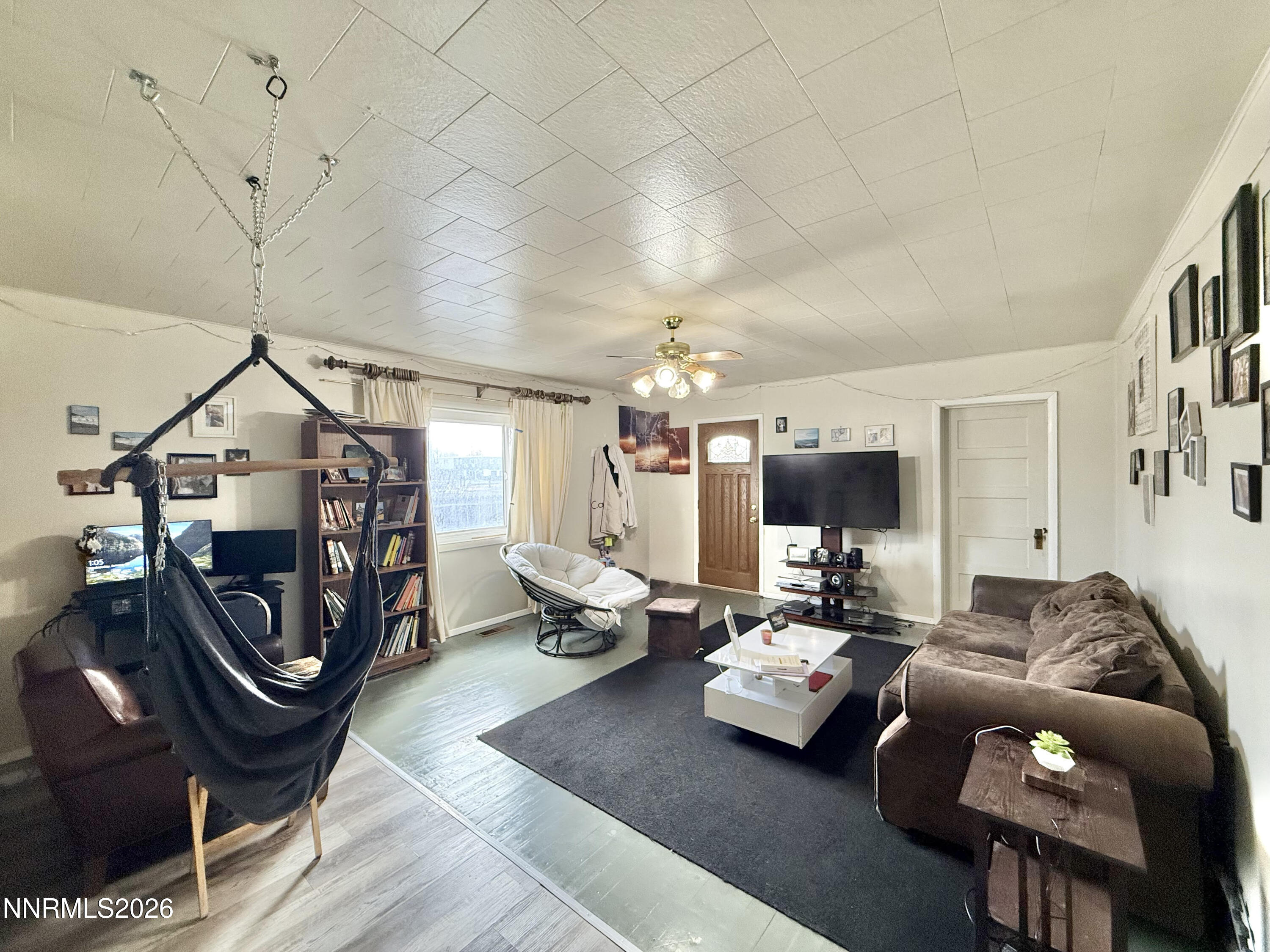 68 West 5th Street Battle Mountain, NV 89820 - Photo 3 of 20 a living room with furniture and a chandelier